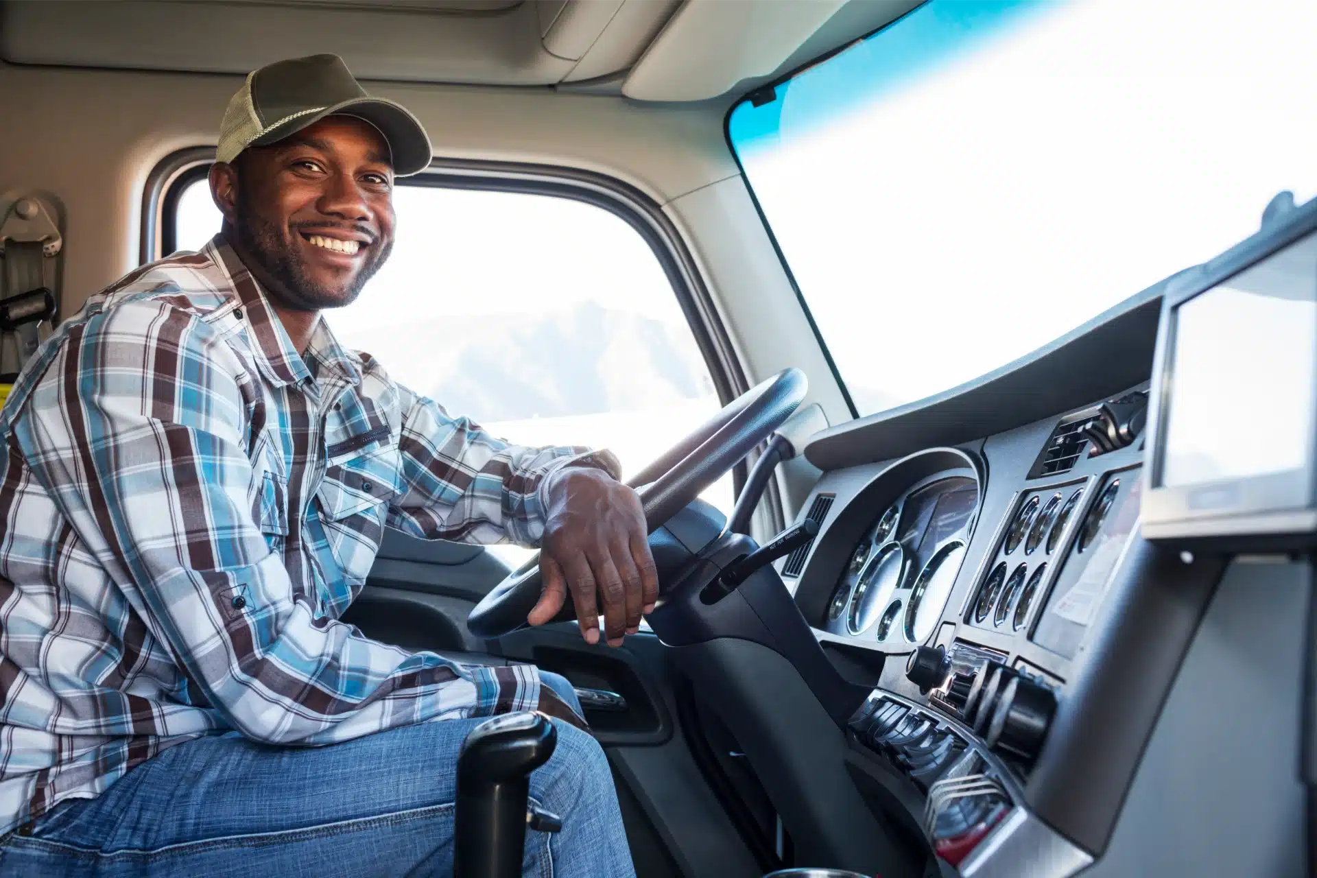black-man-truck-driver-in-the-cab-of-his-commercia-2025-04-03-16-31-24-utc